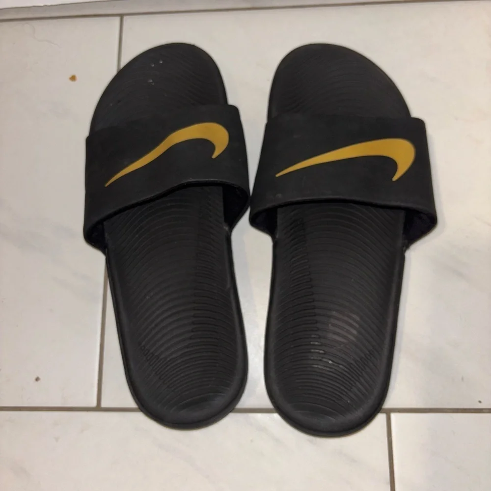 Nike Kids Black Slides with Gold Swoosh